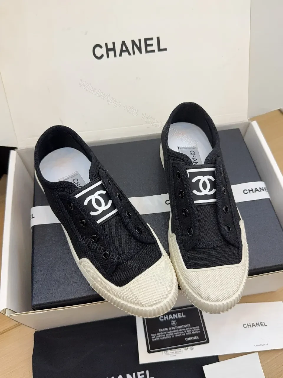 View 5 of Minimalist Black Canvas Sneakers with Logo Strap
