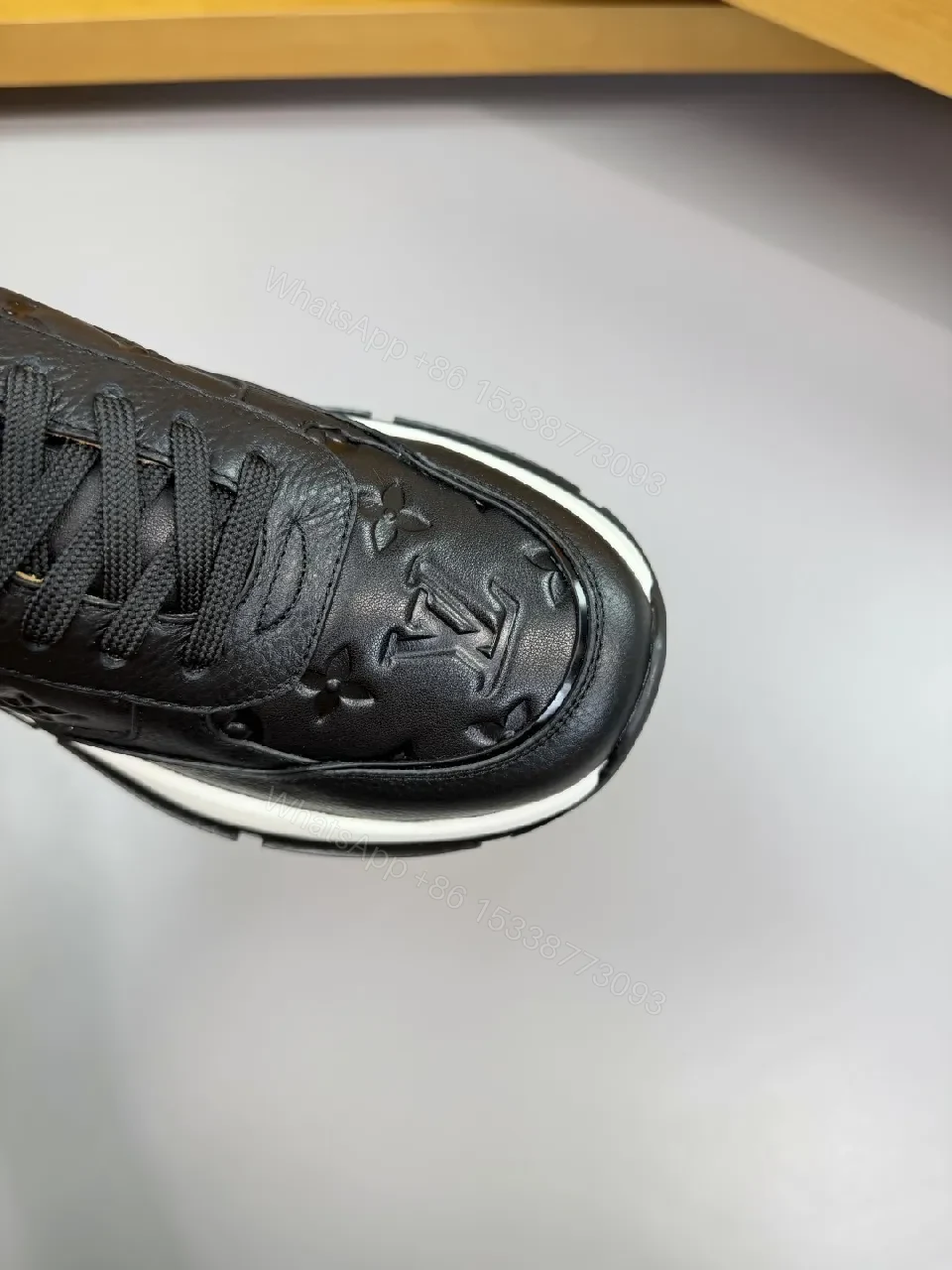 View 5 of Black Leather Trainer with Subtle Monogram Detailing - Everyday Luxe Comfort