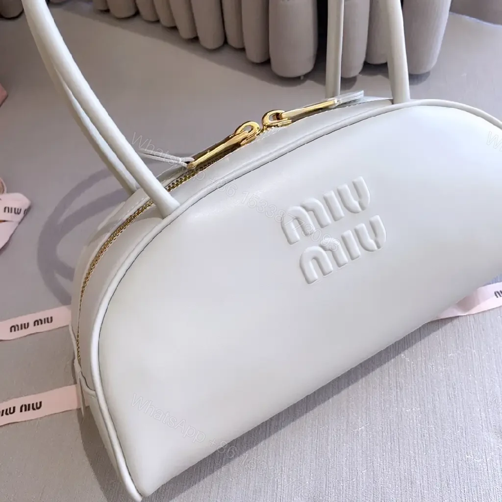 View 3 of Light Leather Dome Bag in Soft Hue, Compact Day-to-Night Carry