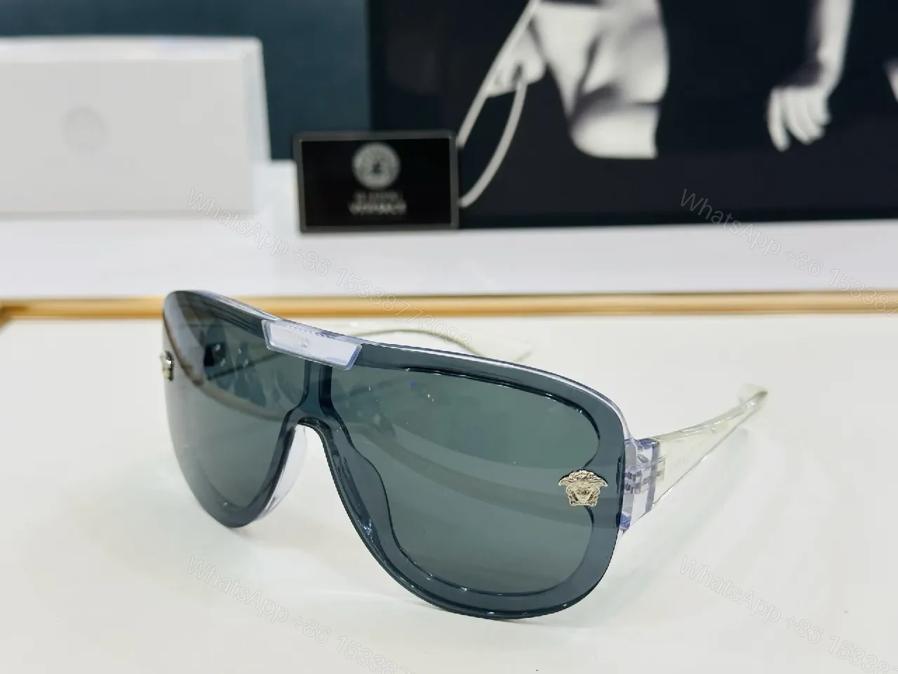 View 2 of Black Gloss Shield Sunglasses with Gold Emblems, Oversized Style