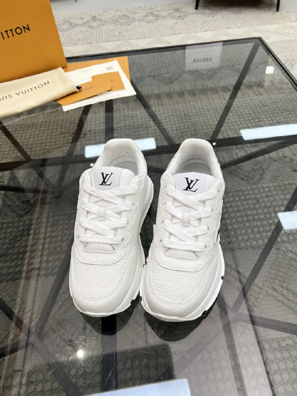 View 2 of White Leather Low-Top Luxury Sneakers with Subtle Logo Detail