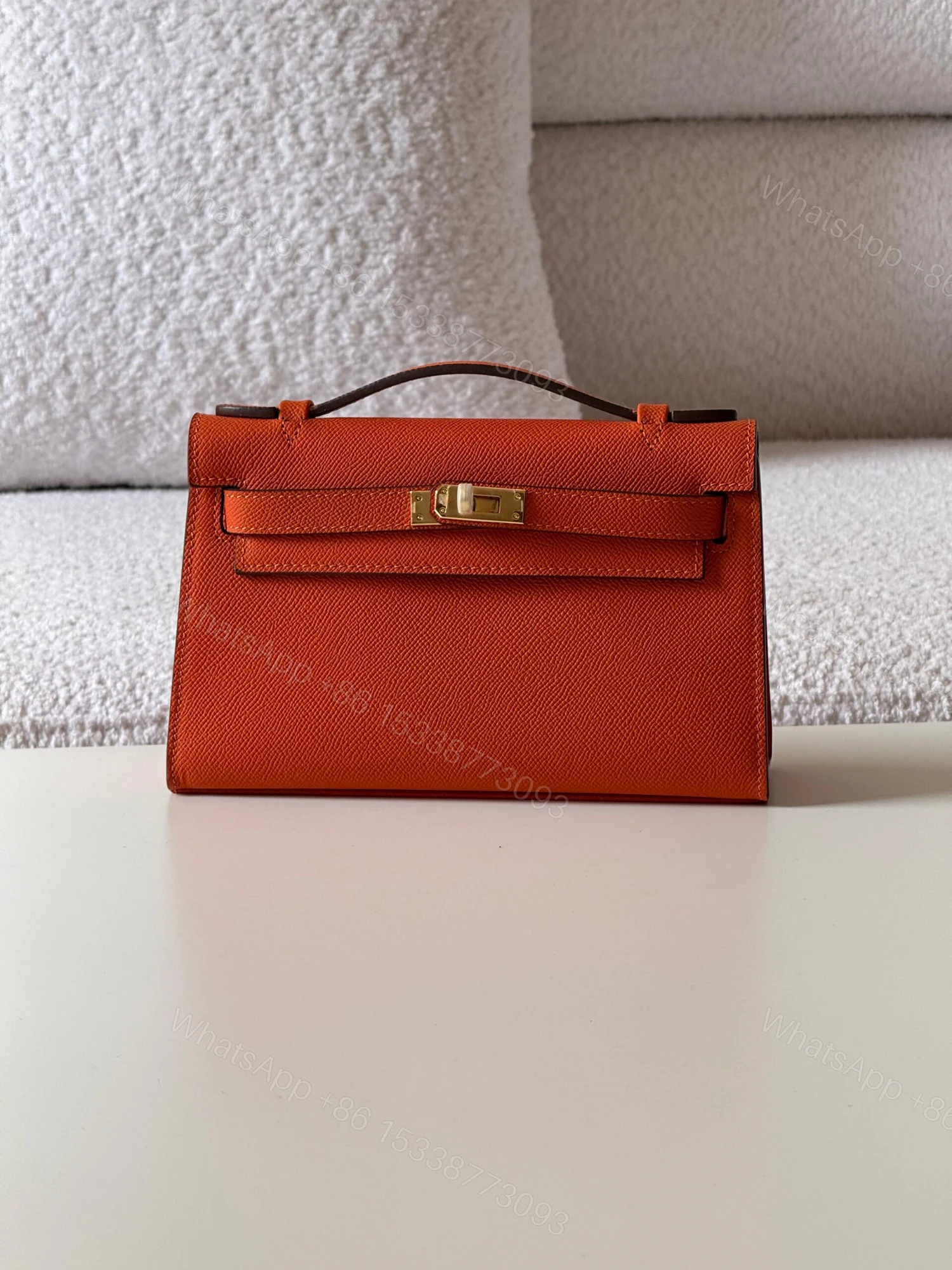 Hermès Kelly Orange Poppy Pochette Bag — view 1