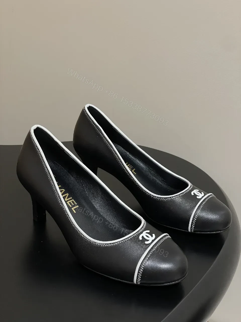 View 4 of Black Leather Kitten-Heel Pumps with Signature Detailing