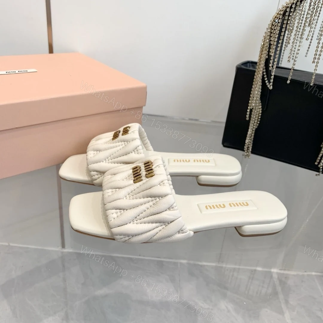 View 2 of MIUMIU MATELASSÉ NAPPA LEATHER SLIDES WHITE 5XX605 88T F0009 F 010