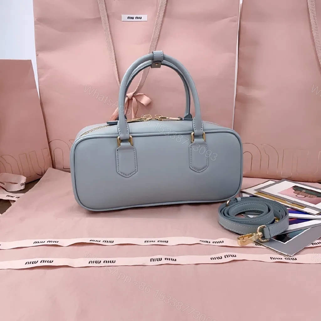 View 3 of Structured Dome Bag: Compact Luxury, Gold Accents, Versatile Style