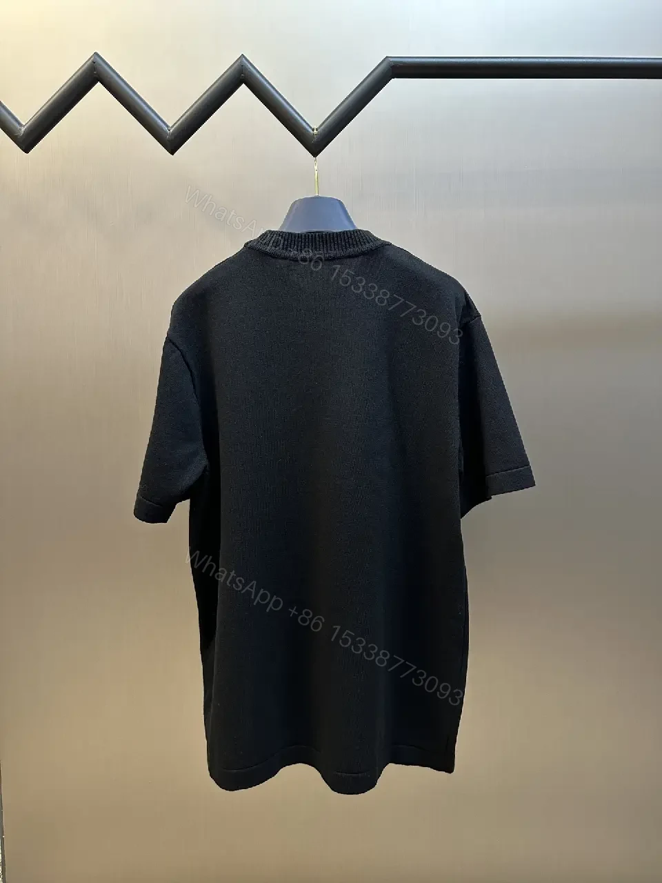View 5 of Minimalist Black Crewneck Tee Dress – Subtle Logo, Versatile Dress