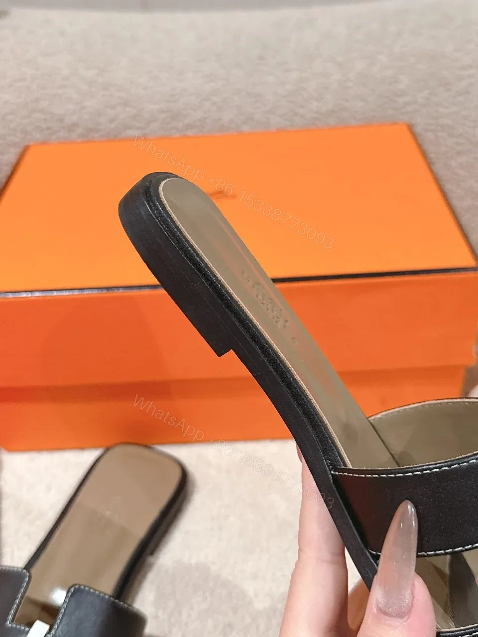 View 2 of Patterned Stride Sandals in Black Leather – Luxury Flat Slides