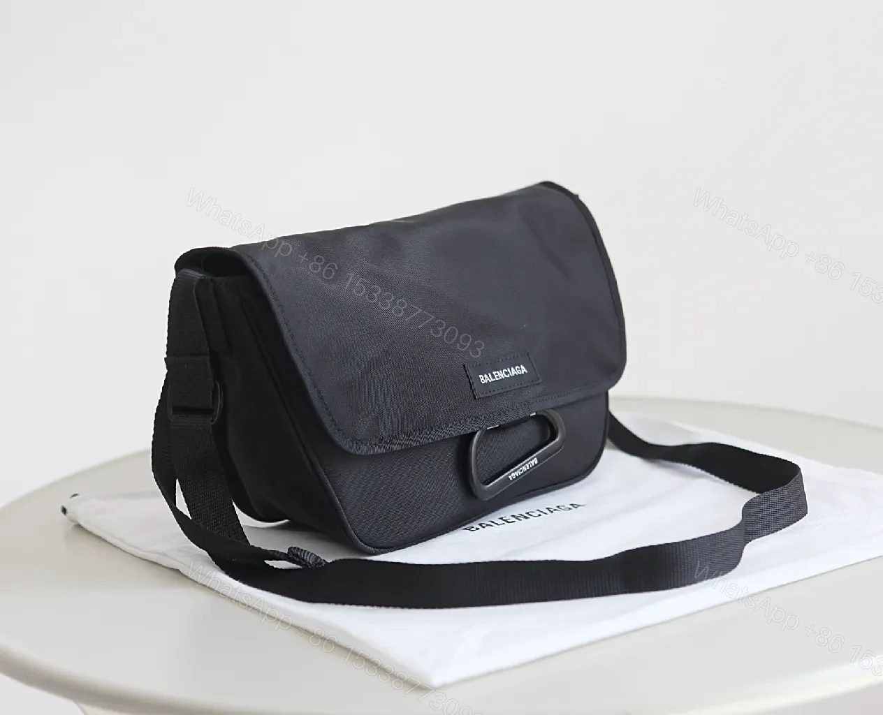 View 3 of Black Durable Matte Nylon Messenger Bag – Compact, Adjustable Strap, Minimalist Style