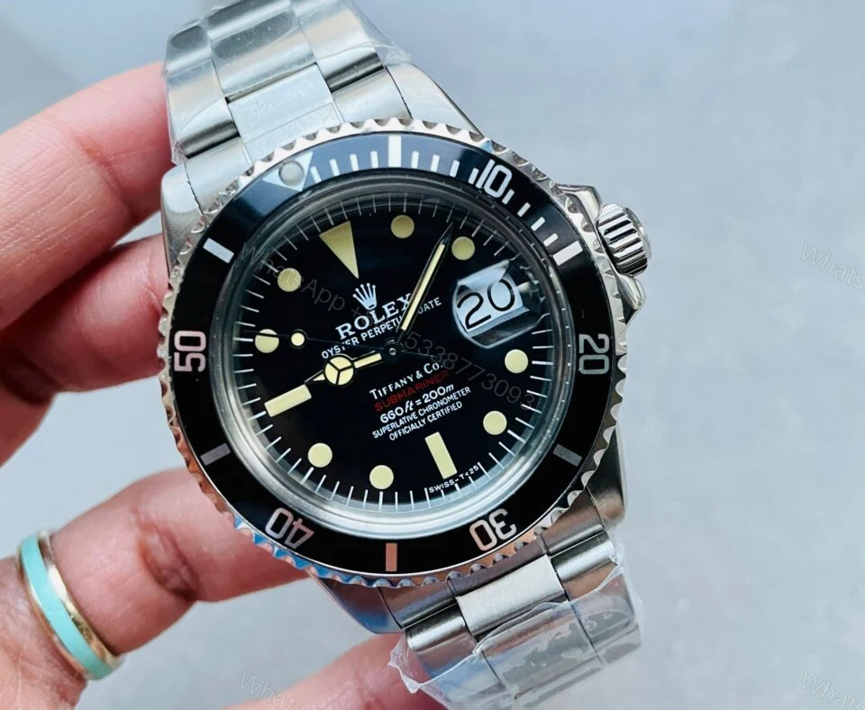 View 2 of VINTAGE Rolex Submariner Date Tiffany & Co 16610A30B9315 Black dial with SS bracelet