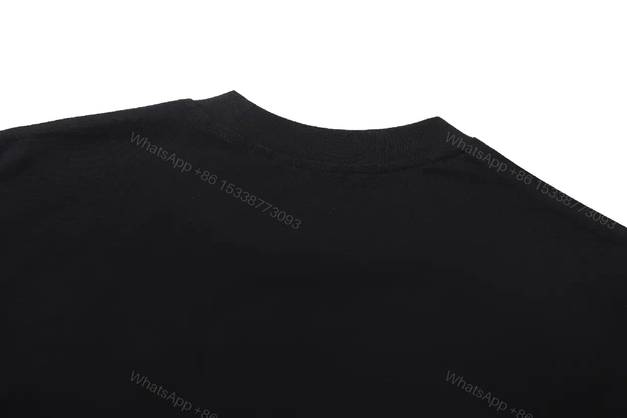 View 7 of Black Cotton Tee with Crest – Subtle Luxe Streetwear Top