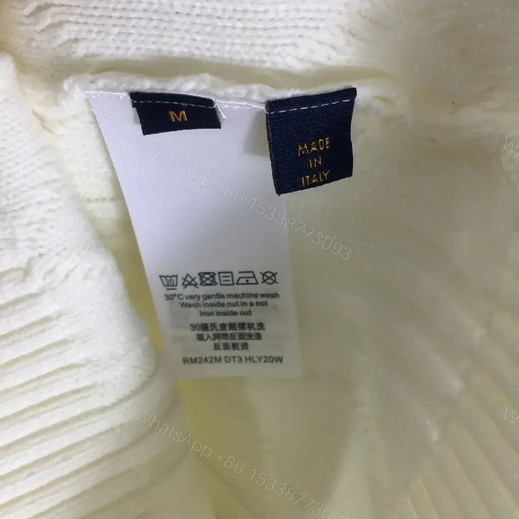 View 2 of Creamy Off-White Cable-Knit Crewneck Sweater with Striped Cuffs