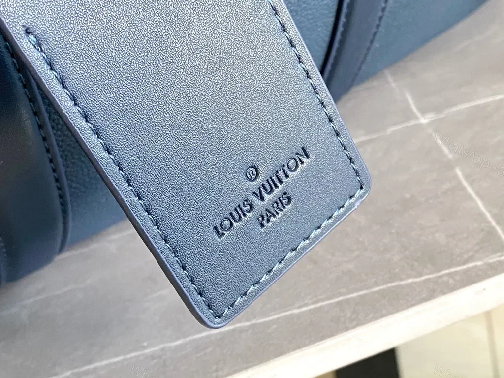 View 6 of Bold Blue Duffle Bag: Pebble Leather-Inspired Luxury Carryall