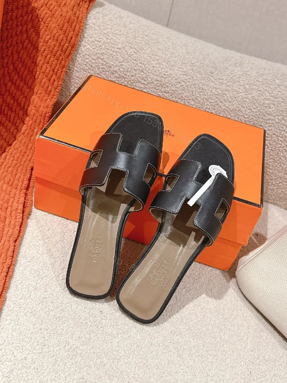 View 6 of Patterned Stride Sandals in Black Leather – Luxury Flat Slides