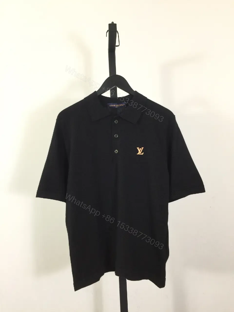 View 5 of Solid Black Polo Shirt with Gold LV Logo, Short Sleeves, Classic Collar