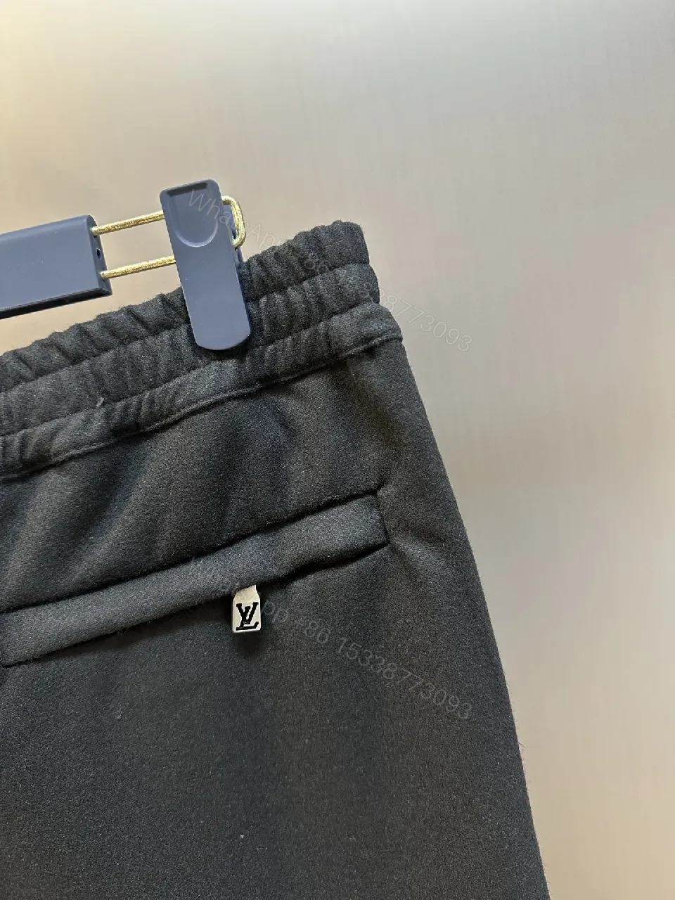 View 5 of Minimalist Tailored Trousers: Subtle LV Monogram Detail