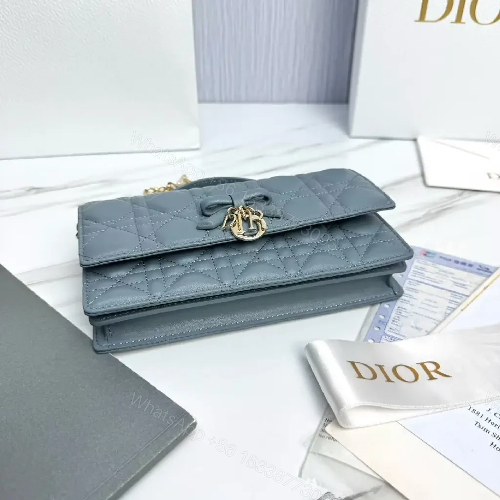 View 7 of Muted Blue-Gray Quilted Crossbody with Bow Charm, Luxe Everyday