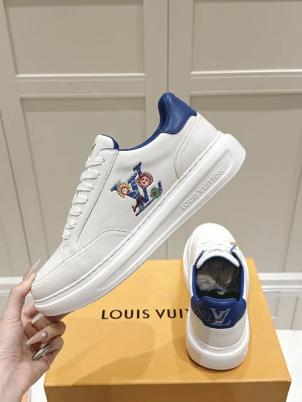 View 8 of Clean White Leather Low-Top Sneakers with Subtle Designer Embellishments