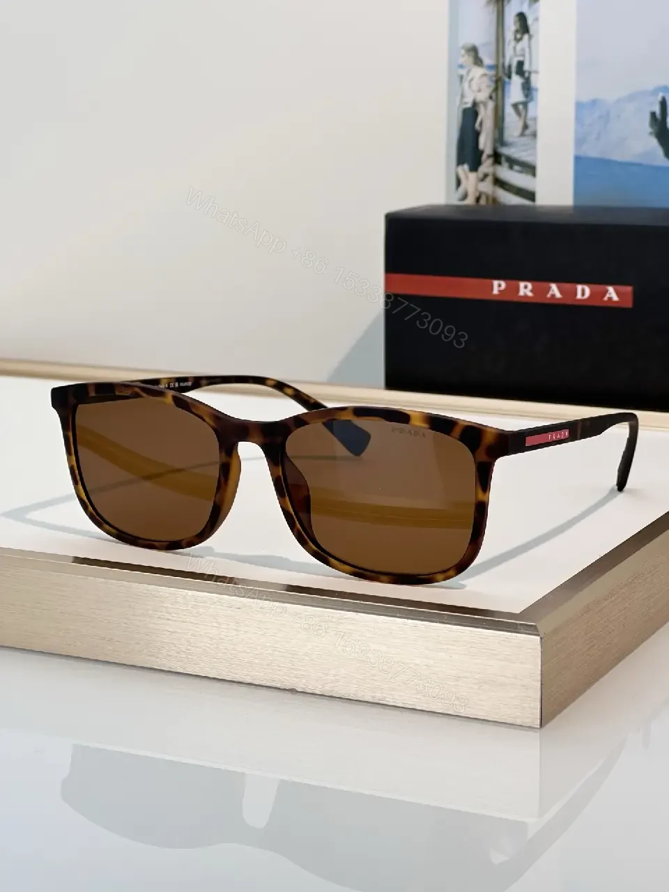 View 4 of Brown Tortoiseshell Sunglasses, Wayfarer-Inspired, Full-Frame, Mottled Pattern, Prada Logo Front