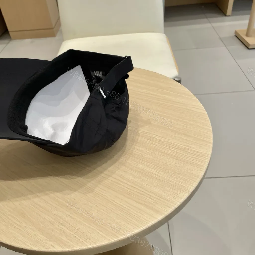 View 4 of Compact Black Cap with Subtle LV Patch, Six-Panel, Adjustable Strap