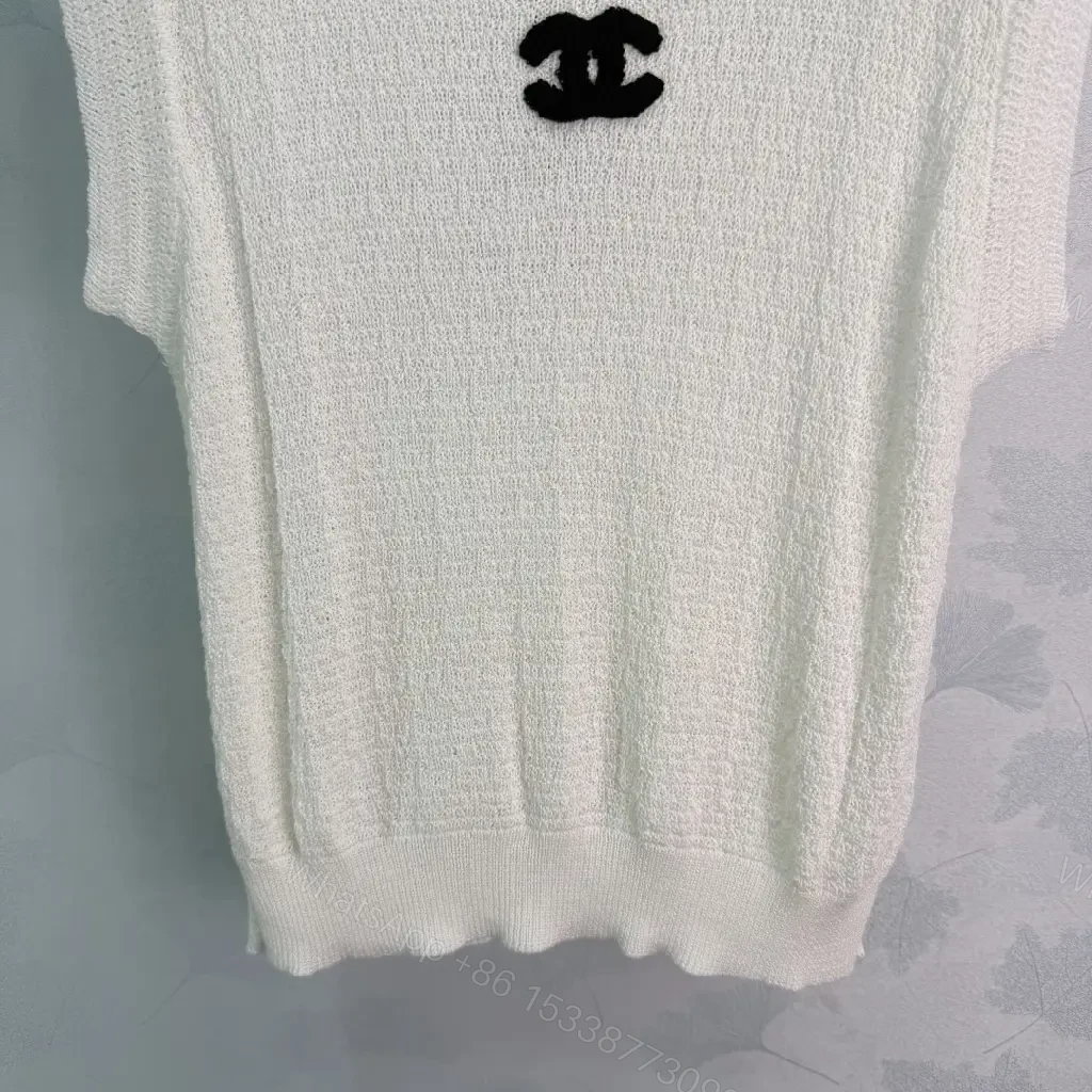 View 8 of White boucle knit relaxed-fit sweater with Chanel logo