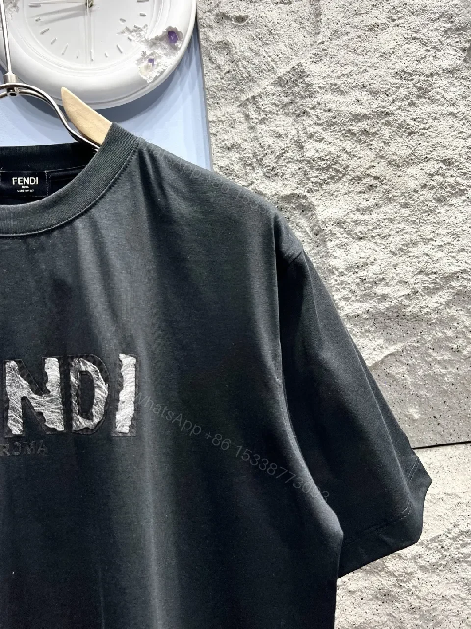 View 8 of Minimalist Black Cotton Tee with Elevated Logo Texture