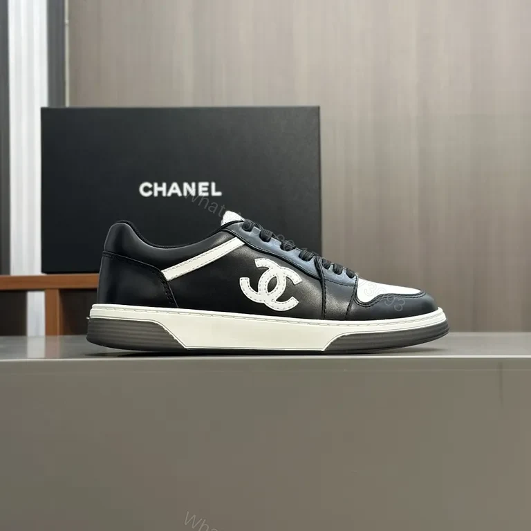 View 3 of Monochrome Chanel-Style Low-Top Sneakers with Signature Emblem
