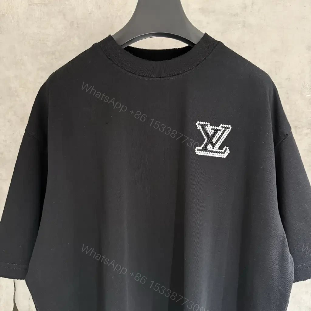 View 9 of Oversized Black Knit Tee, Luxury Crest Embroidery, Casual Comfort