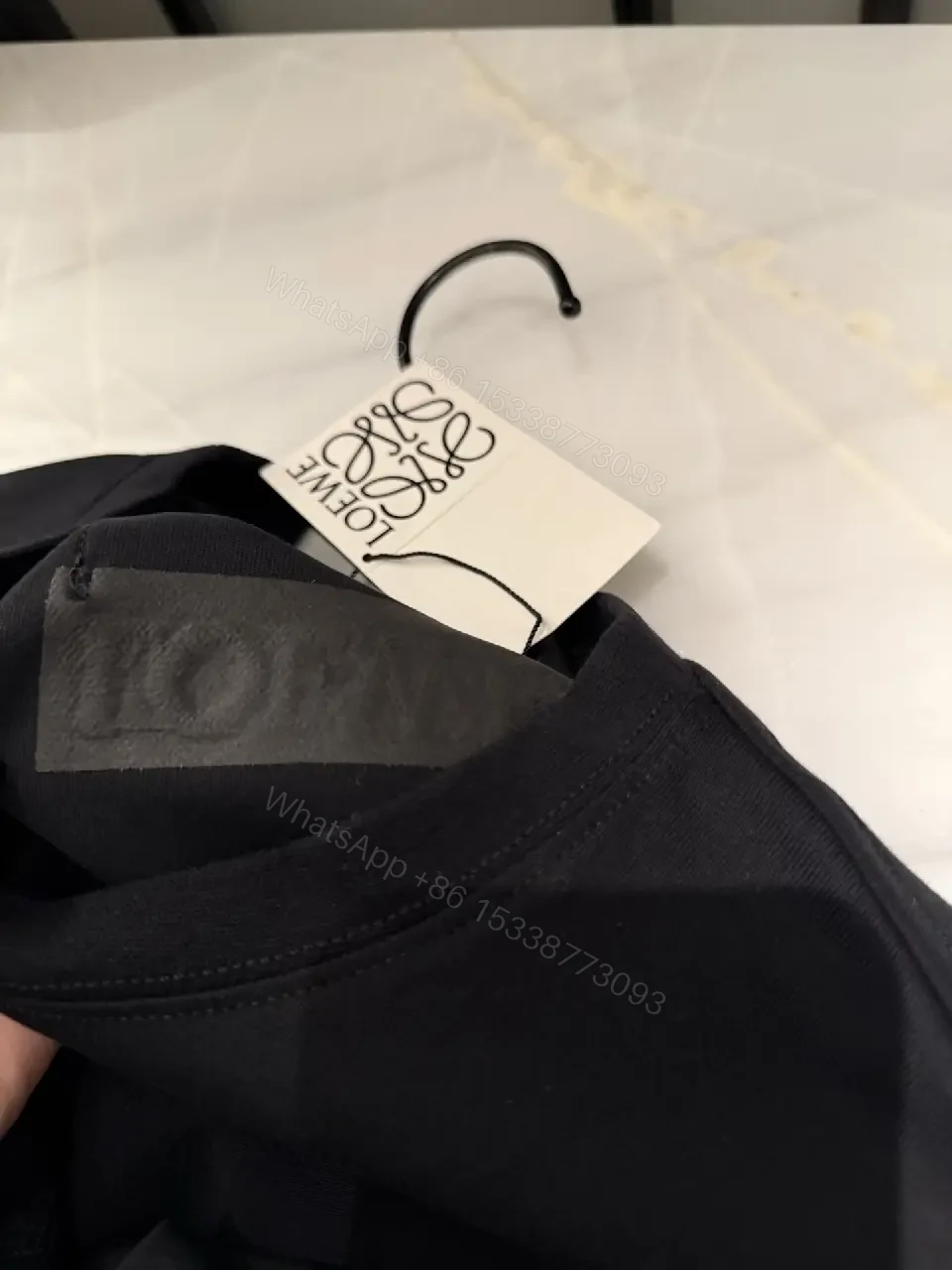 View 3 of Black Cotton Crew Tee with Pocket – Subtle Luxe Comfort