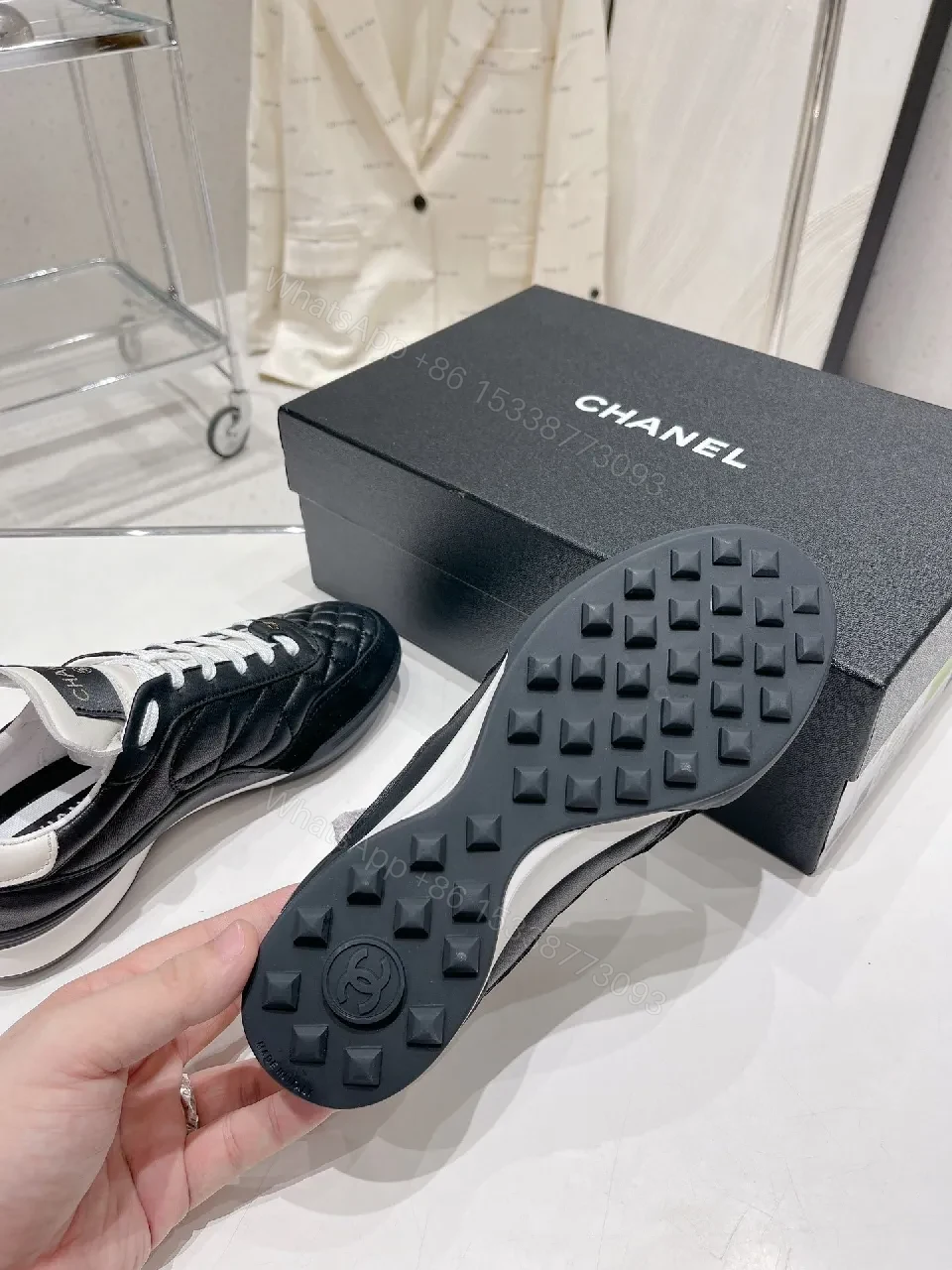 View 2 of Quilted Black Leather Sneakers with Luxe Branding Detail