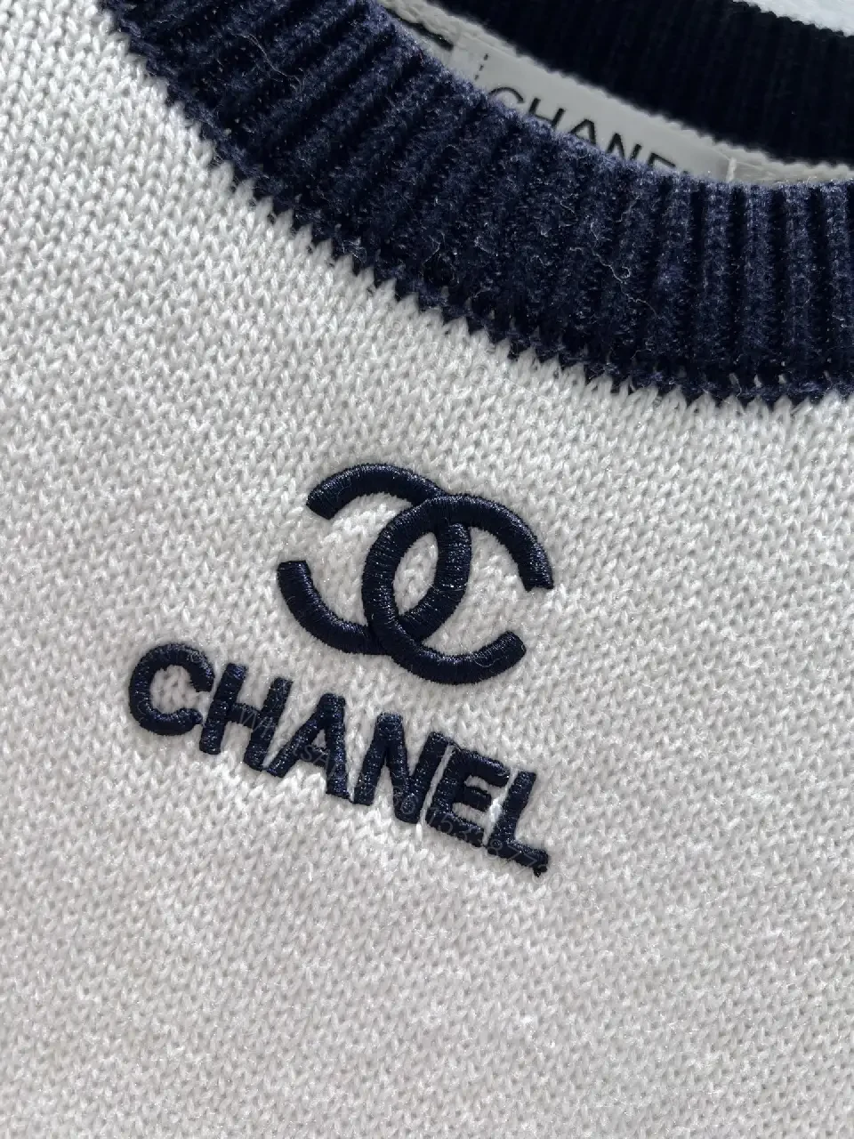 View 4 of Two-Tone Knit Tee with Signature Logo Emblem - Modern Luxury Casual