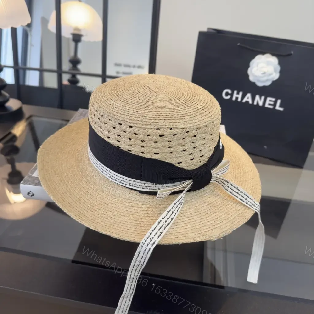 View 3 of Natural Straw Fedora Hat with Bow Ribbon Detail - Chanel Logo
