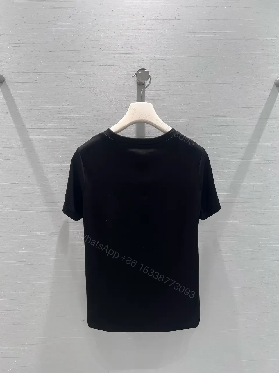 View 9 of Minimalist Black Cotton Tee with Discreet Emblem