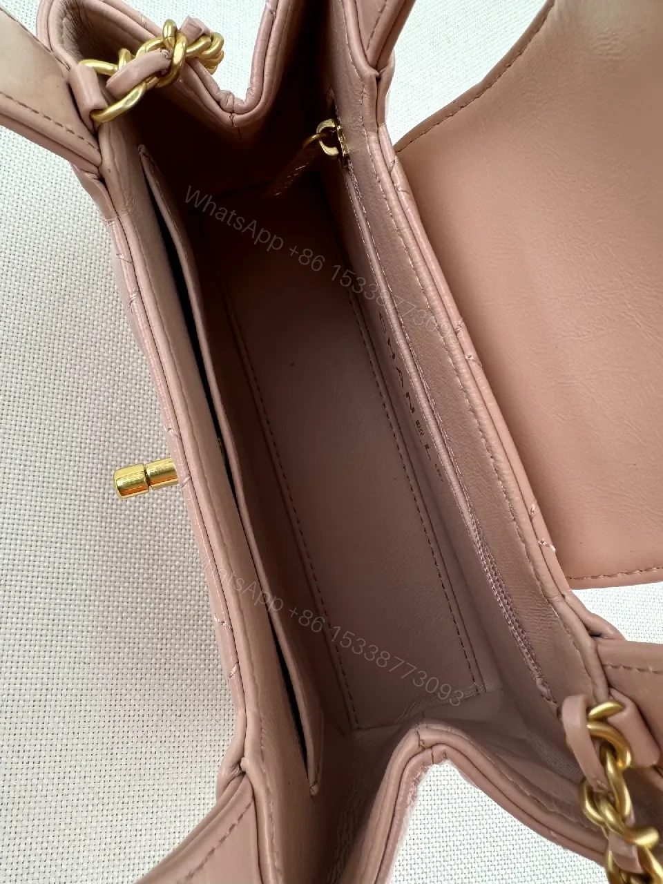 View 5 of Soft Pink Quilted Mini Bag with Gold Hardware, Elegant Twist, Mini Bag