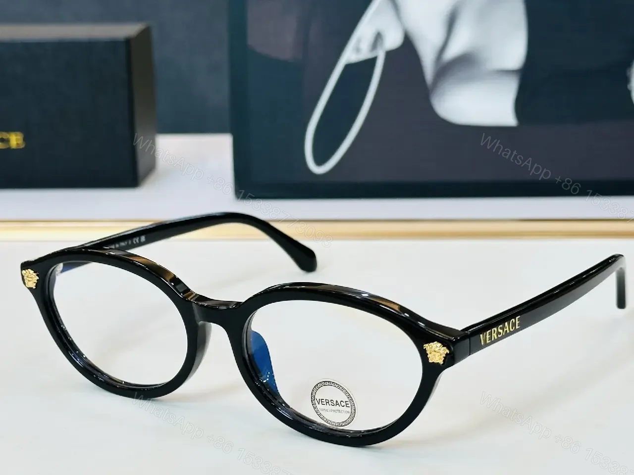 View 10 of Glassy Black Round Sunglasses with Gold Accents, UV400 Protection