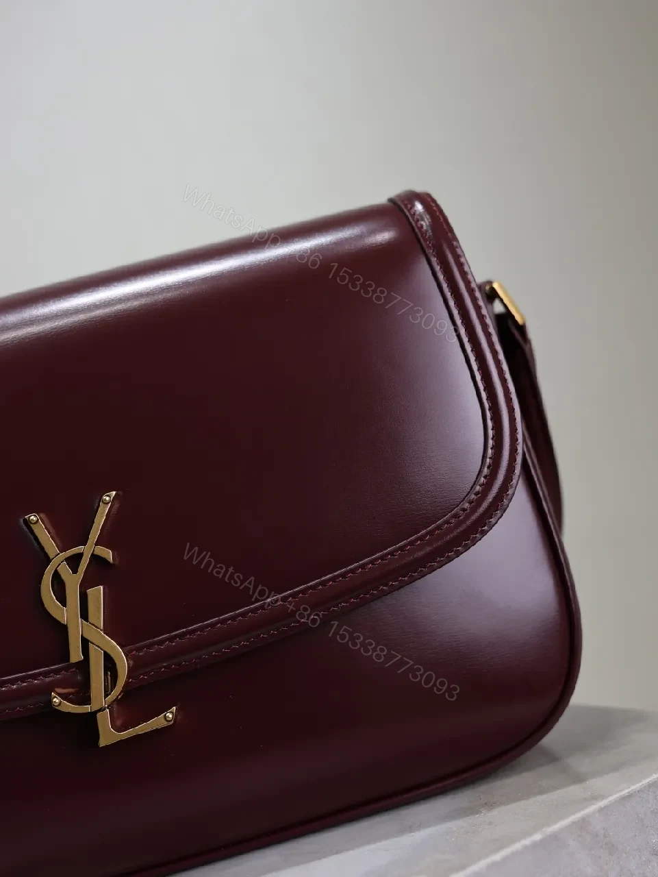 View 4 of Structured Burgundy Leather Crossbody: Gold Logo, Modern Chic