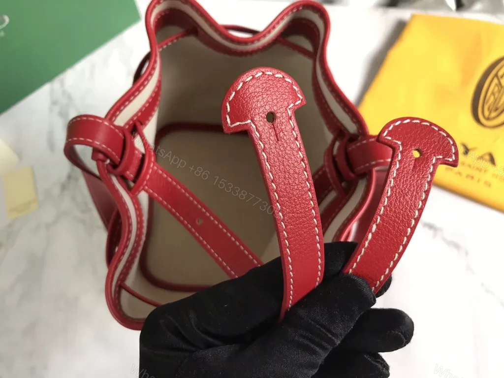 View 4 of Bold Goyardine Bucket Bag in Red Leather Trim