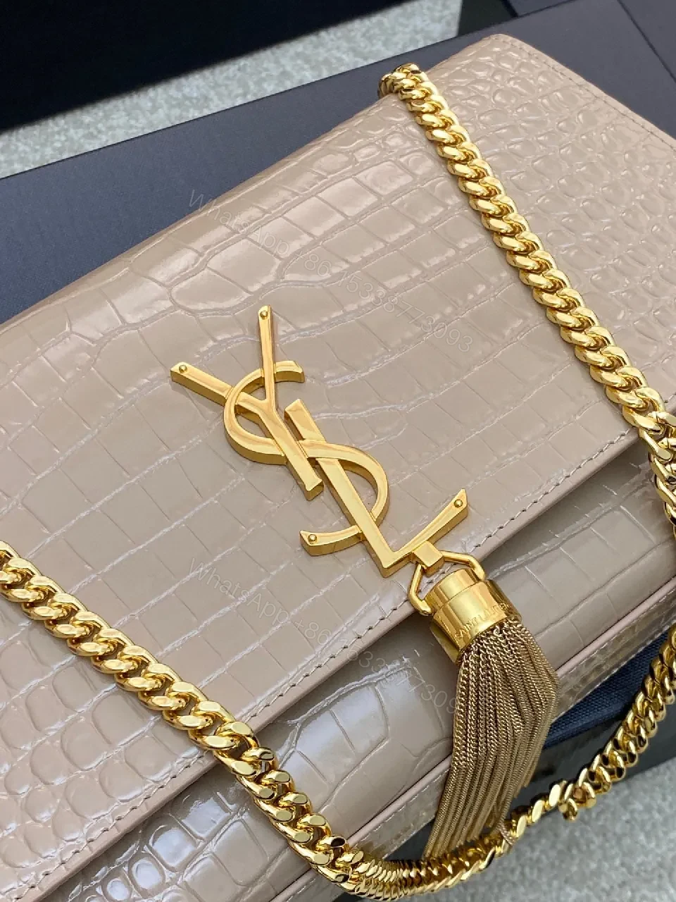 View 9 of Taupe Crocodile-Embossed Clutch with Gold Monogram and Tassel
