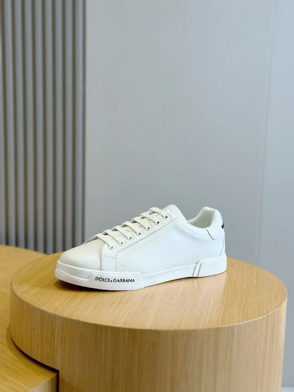 View 6 of Minimal White Leather Sneakers with Subtle Designer Detailing