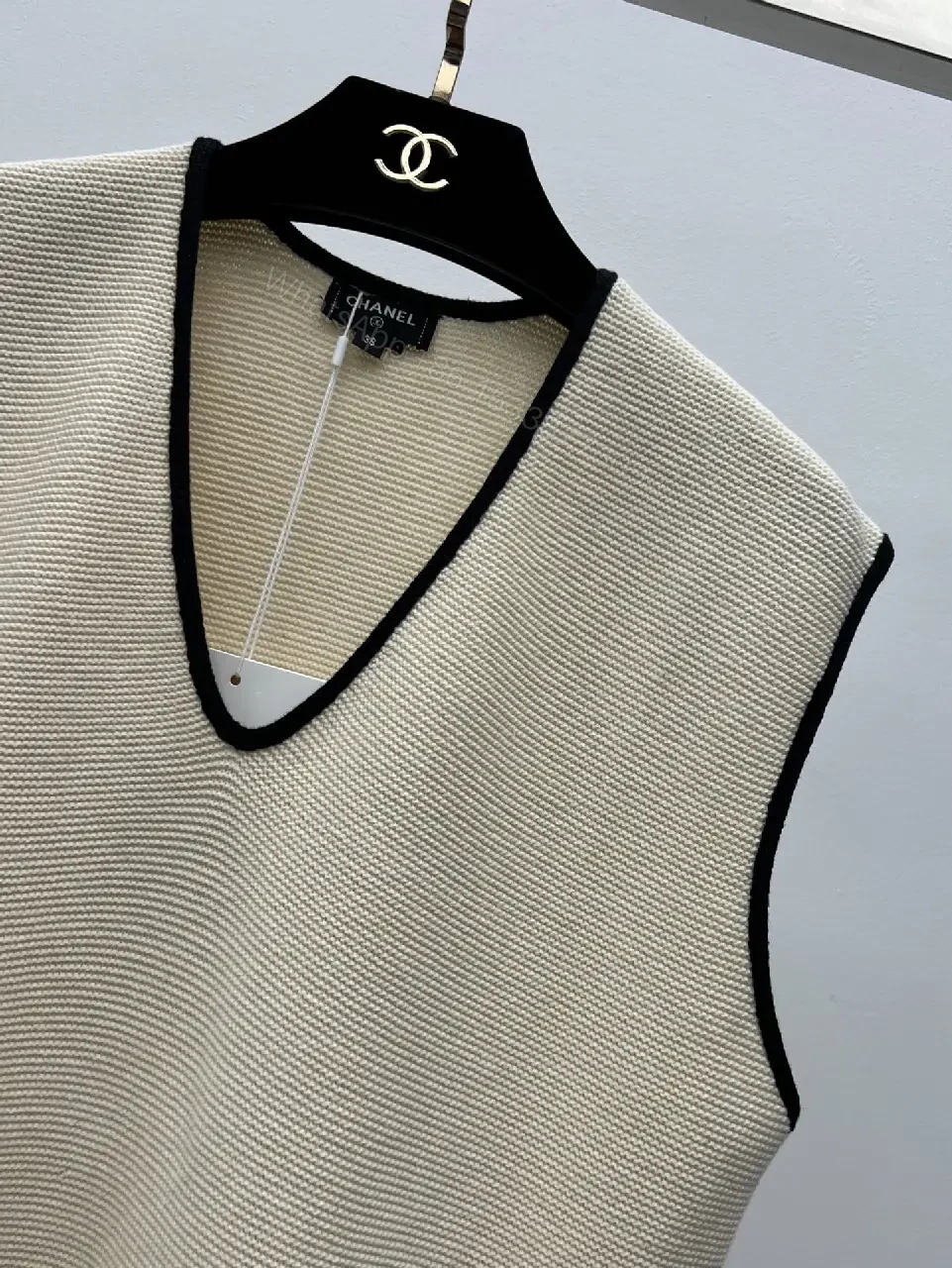 View 2 of Beige Knit Vest Black Trim V-Neck Chanel Logo Patch Tank Vest