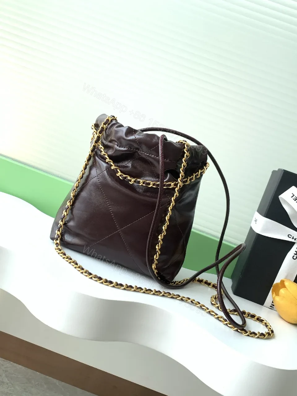 View 6 of Gold-Traced Quilted Bucket Bag: Luxury Leather, Iconic Hardware