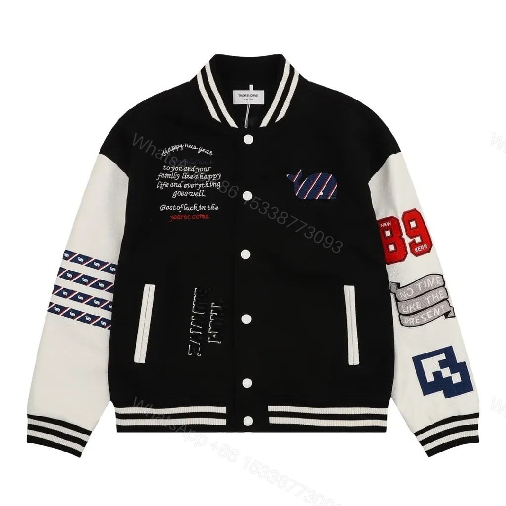 Bold Black & Off-White Varsity Jacket with Embroidered Graffiti Details — view 1