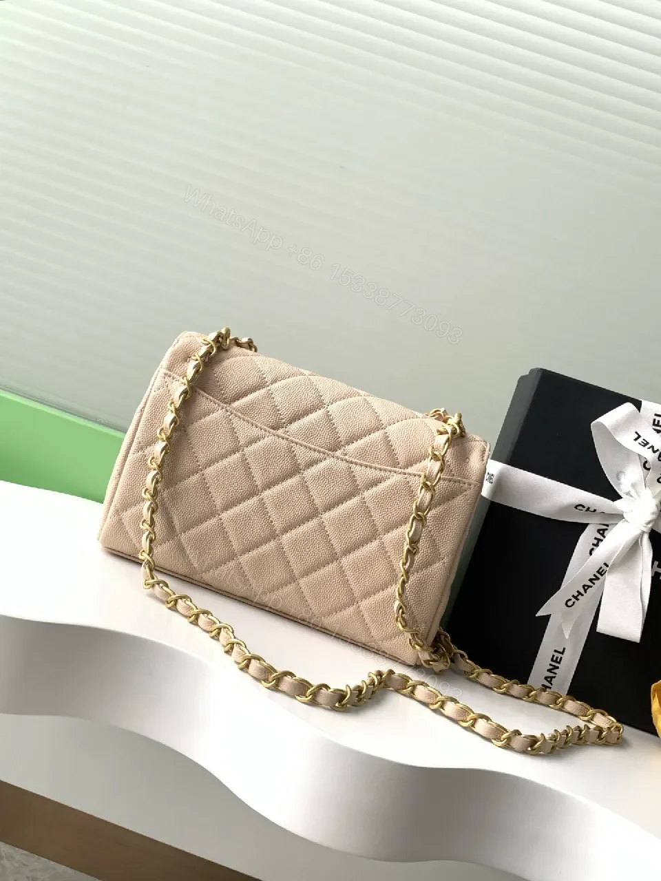 View 3 of Soft Beige Quilted Bag with Luxe Chain – Compact Luxury Tote