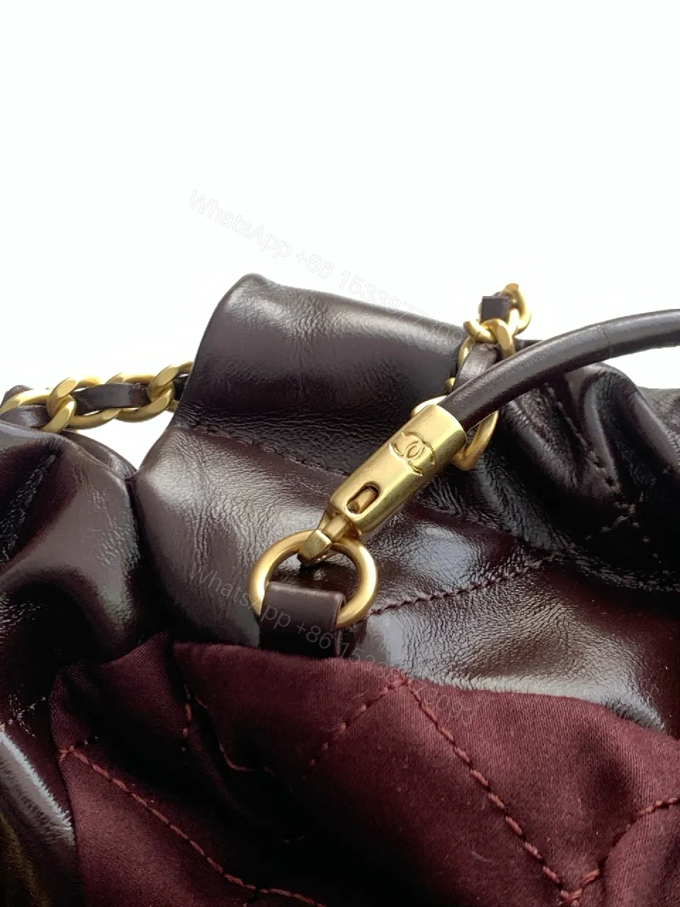 View 3 of Gold-Traced Quilted Bucket Bag: Luxury Leather, Iconic Hardware