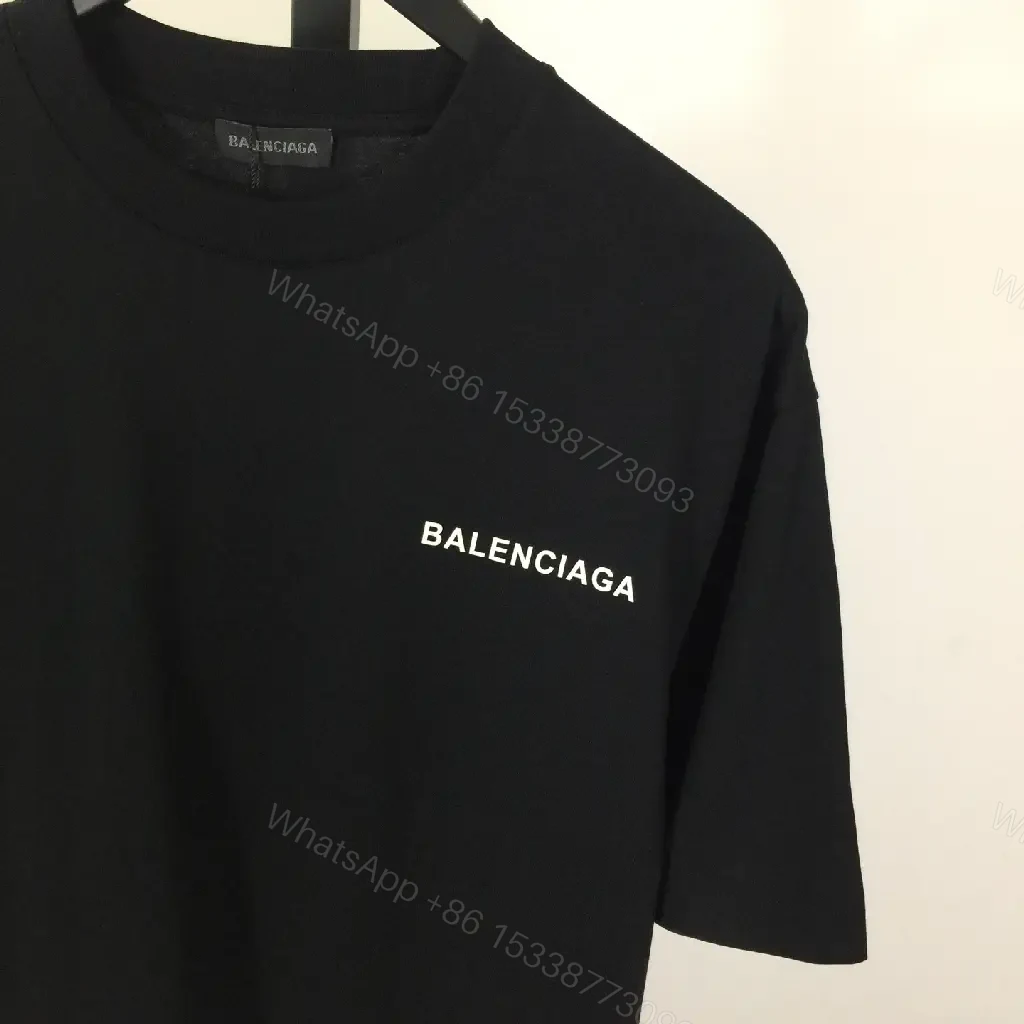 View 7 of Minimalist Black Mockneck Tee: Premium Cotton, Subtle Logo, Versatile Style
