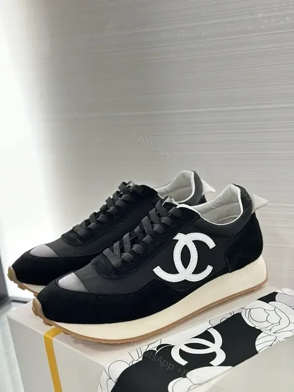 Sleek Black Knit High-Top Sneaker with Signature Emblem, Luxury — view 1