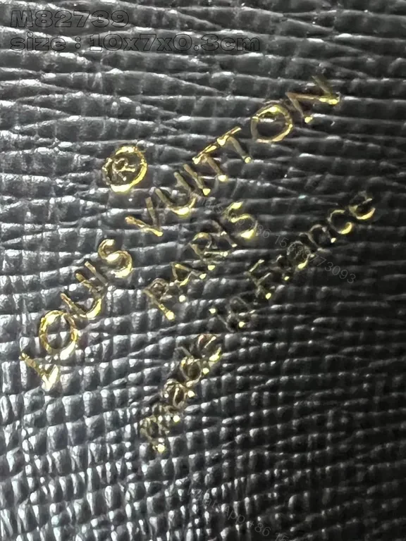 View 2 of Compact Black Textured Wallet with LV-Style Logo Details