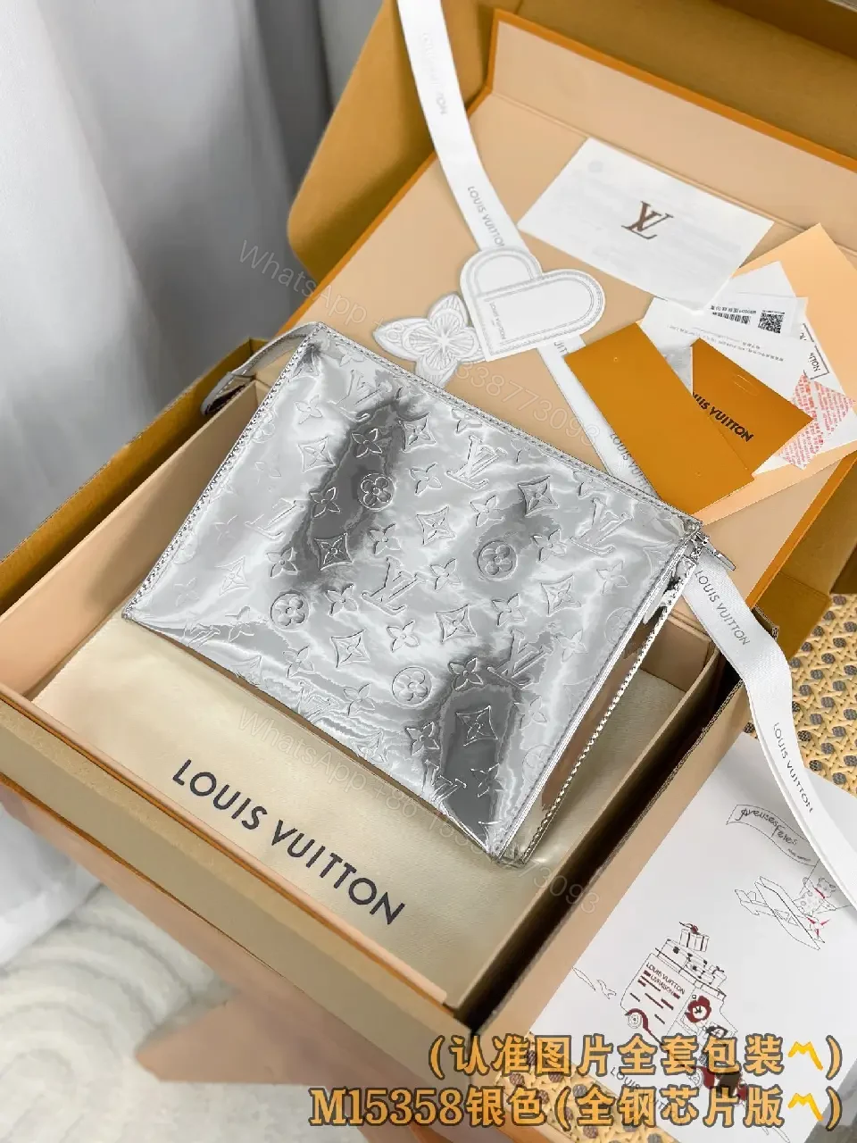 View 2 of Metallic Silver Pouch with Signature Motifs—Chic All-Day Gleam