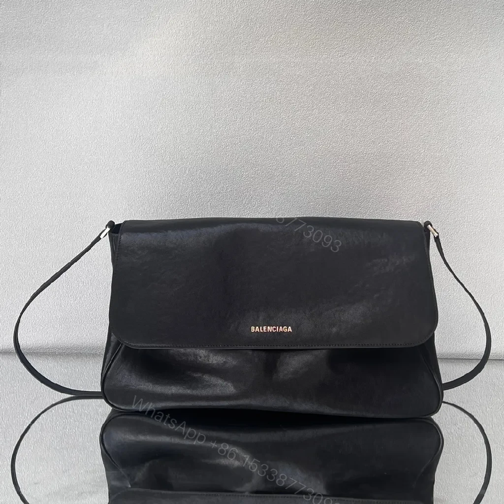Minimalist Black Leather Crossbody: Compact Luxury Bag — view 1