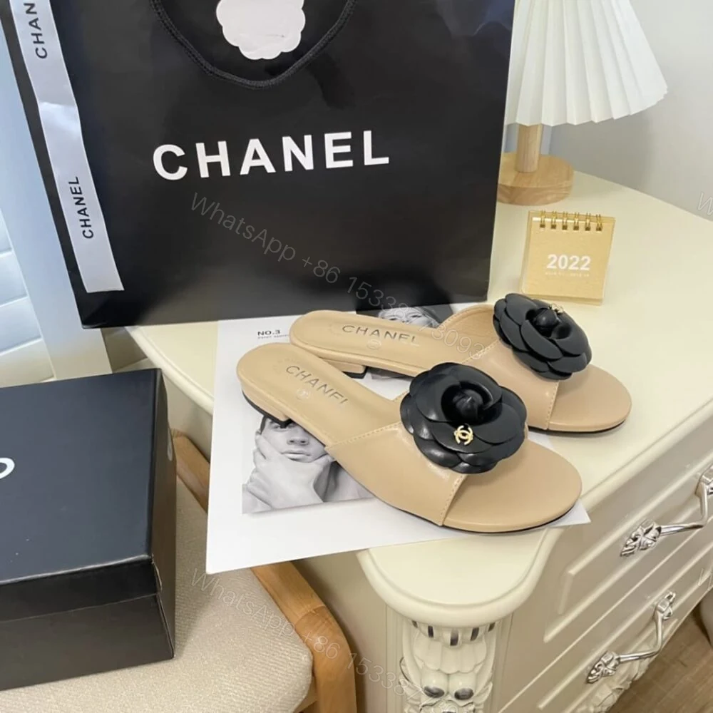 View 2 of Chanel Black Camellia Slides Beige