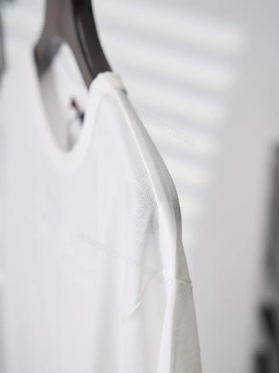 View 9 of White cotton T-shirt with luxury script embroidery for everyday elegance